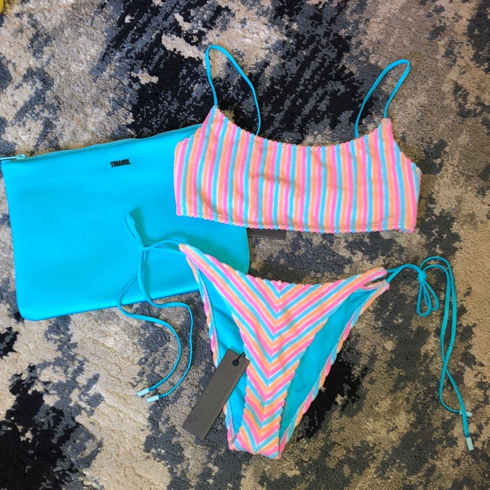 Sport style top and string bottom swimsuit set with bag.